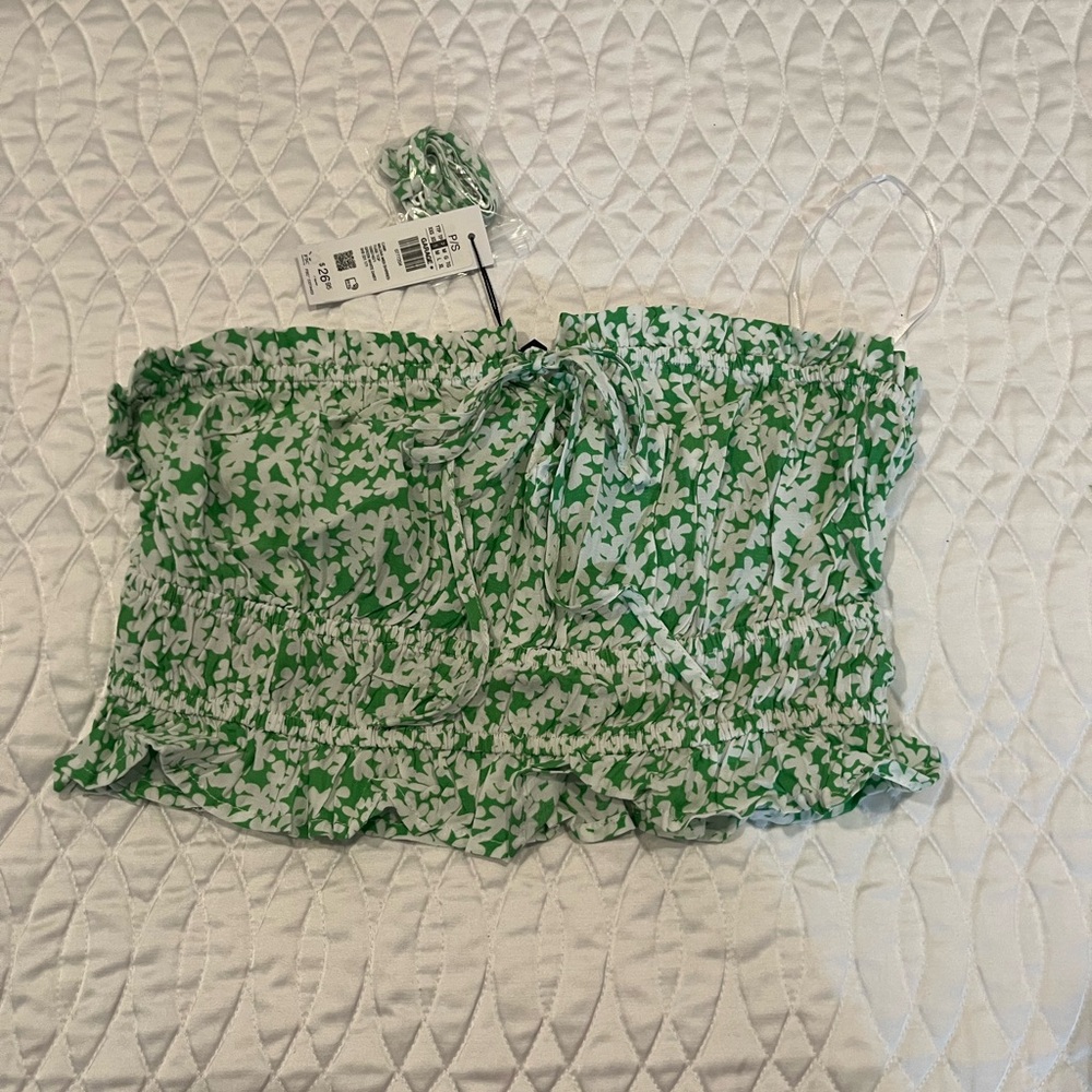 Green kind of tube top with little bow in front